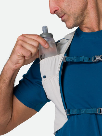 color:Vapor Grey||seo:Nathan Pinnacle FeatherLite 1.5 Liter Unisex Hydration Vest - Vapor Grey - Female Runner Pulling 14oz (414 ml) Flask From Front Storage Pocket