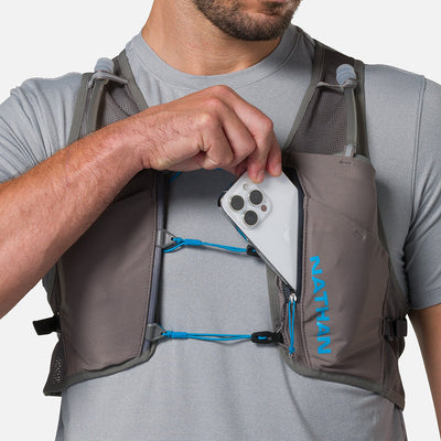 color:Charcoal/Electric Blue||seo:Nathan Pinnacle Breeze 4 Liter Unisex Hydration Race Vest - Charcoal/Electric Blue - Male Runner Pulling iPhone From Front Storage Pocket