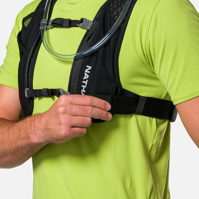 color:Black/Reflective Silver||seo:Nathan QuickStart 3.0 4 Liter Hydration Pack - Black/Reflective Silver - On Model - Model Adjusting Wide Side Straps For a Secure No Bounce Fit