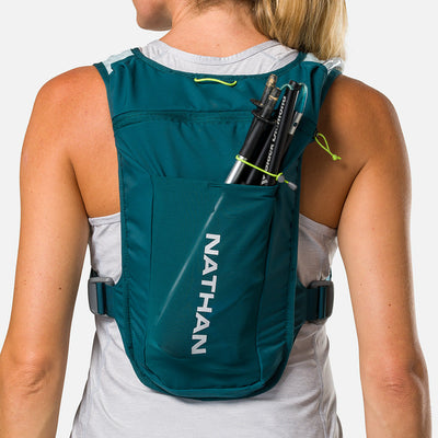 color:Deep Teal/Reflective Silver||seo:Nathan QuickStart 3.0 4 Liter Hydration Pack - Deep Teal/Reflective Silver - On Model - Large back expandable mesh pocket perfect for clothes, gear and other larger essentials, plus elastic pole keeper