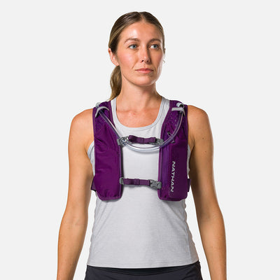 color:Imperial Purple/Reflective Silver||view:sku image back||seo:Nathan QuickStart 3.0 4 Liter Hydration Pack - Imperial Purple/Reflective Silver - On Model - Front View