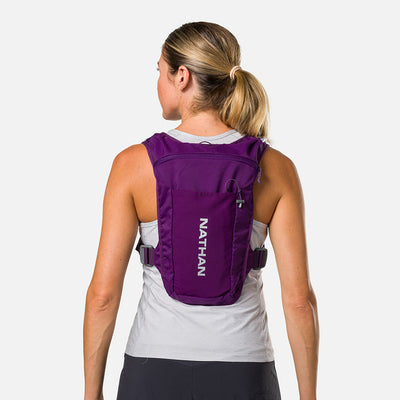 color:Imperial Purple/Reflective Silver||seo:Nathan QuickStart 3.0 4 Liter Hydration Pack - Imperial Purple/Reflective Silver - On Model - Back View