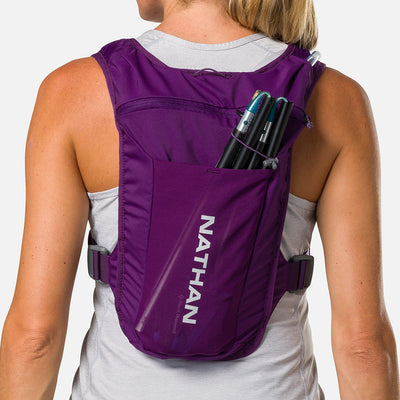 color:Imperial Purple/Reflective Silver||seo:Nathan QuickStart 3.0 4 Liter Hydration Pack - Imperial Purple/Reflective Silver - On Model - Large back expandable mesh pocket perfect for clothes, gear and other larger essentials, plus elastic pole keeper
