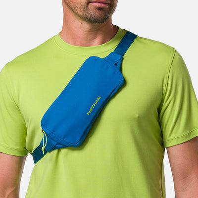 color:Deep Blue/Finish Lime||seo:Nathan Marathon Waist Pack 3.0 - Deep Blue/Finish Lime - On Model - Cross Body Over Shoulder