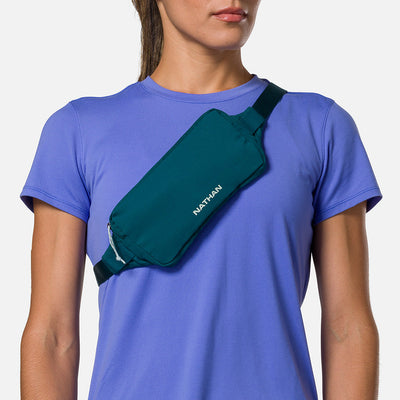 color:Deep Teal/Surf Spray||seo:Nathan Marathon Waist Pack 3.0 - Deep Teal/Surf Spray - On Model - Cross Body Over Shoulder
