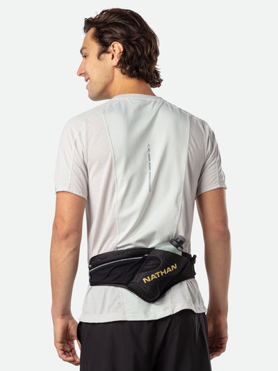 color:Black/Gold||seo:Nathan Peak Hydration Waist Pack - Black/Gold - On Model - Back of Pack