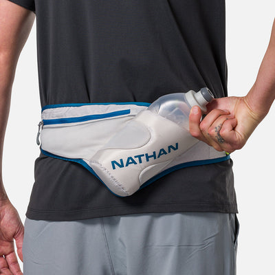 color:Vapor Grey/Sailor Blue||view:sku image back||seo:Nathan Peak Hydration Waist Pack - Vapor Grey/Sailor Blue - On Model - Pulling Hydration Flask From Pouch