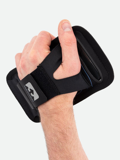 Nathan Vista Handheld Phone Carrier - On Model - Gripping Carrier Through Sleeve View 2