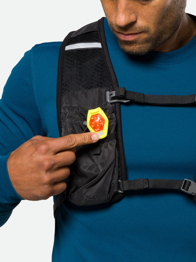 color:Safety Yellow||seo:Nathan HyperBrite RX Strobe Rechargeable LED Clip Light - Safety Yellow - On Model - Turning on Clip Light Attached to Hydration Vest