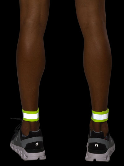 Nathan Hypernight Reflective Straps – Safety Yellow – On Model – Back Reflective Ankle View
