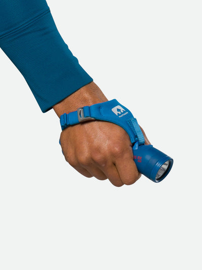 Nathan Polaris 400RX Runner’s Hand Torch – Deep Blue – On Model – Strap on Hand - Closed Palm