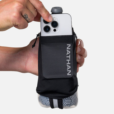 color:Black/Reflective Silver||seo:Nathan SpeedDraw 2 Insulated 18oz Handheld Flask - Black/Reflective Silver - Model Pulling iPhone from Pouch