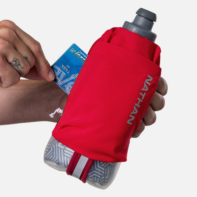 color:Ribbon Red/Reflective Silver||seo:Nathan SpeedDraw 2 Insulated 18oz Handheld Flask - Ribbon Red/Reflective Silver - Model Pulling Credit Card from Zippered Pouch