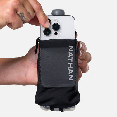 color:Black/Reflective Silver||seo:Nathan SpeedDraw 2 Insulated 12oz Handheld Flask - Black/Reflective Silver - Model Pulling iPhone from Pouch