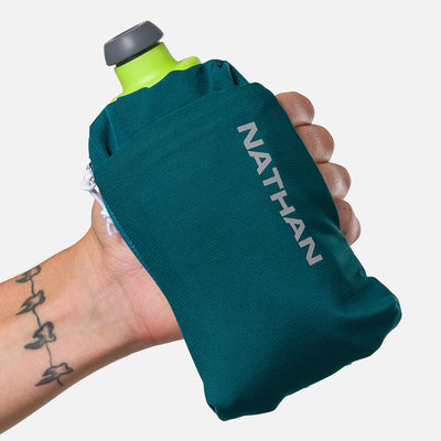 color:Deep Teal/Reflective Silver||seo:Nathan SpeedDraw 2 12oz Handheld Flask - Deep Teal/Reflective Silver - Model Gripping Handheld Flask - Front View