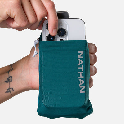color:Deep Teal/Reflective Silver||seo:Nathan SpeedDraw 2 12oz Handheld Flask - Deep Teal/Reflective Silver - Model Pulling iPhone from Pouch
