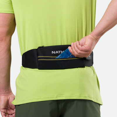 color:Black/High Vis Yellow||seo:Nathan Laser Light 5K Belt RX - Black/High Vis Yellow - Model Pulling Credit Card out of Zippered Pocket