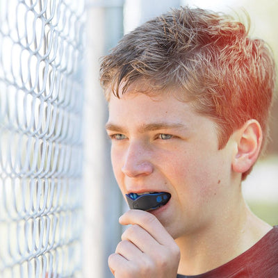 Youth Athlete Wearing Shock Doctor Gel Max Black Mouthguard