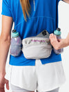 color:Vapor Grey/Magenta||seo:Nathan TrailMix Plus Insulated Hydration Belt 3.0 - Vapor Grey/Magenta - On Model - Pulling Cell Phone From Pocket
