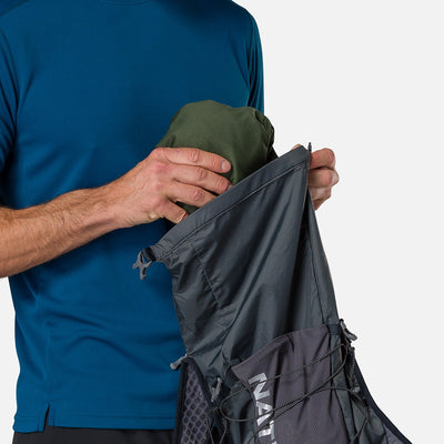 color:Charcoal/Reflective Silver||seo:Nathan TrailMix 2.0 12 Liter Unisex Hydration Pack - Charcoal/Reflective Silver - Male Runner Pulling Jacket from Pack