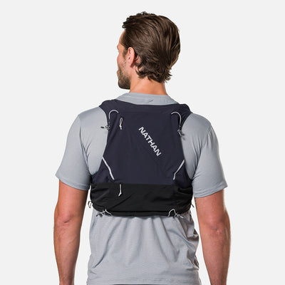 color:Black/Reflective Silver||seo:Nathan Pinnacle Pro 12 Liter Unisex Hydration Race Vest - Black/Reflective Silver - Male Runner Back View
