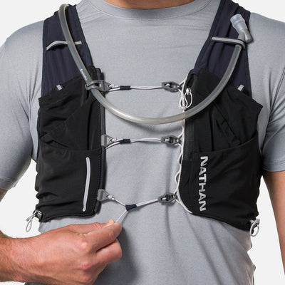 color:Black/Reflective Silver||seo:Nathan Pinnacle Pro 12 Liter Unisex Hydration Race Vest - Black/Reflective Silver - Model Adjusting Sternum Slider Cord System