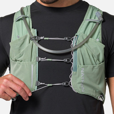 color:Sage Green/Reflective Silver||seo:Nathan Pinnacle Pro 12 Liter Unisex Hydration Race Vest - Sage Green/Reflective Silver - Model Adjusting Sternum Slider Cord System