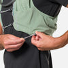 color:Sage Green/Reflective Silver||seo:Nathan Pinnacle Pro 12 Liter Unisex Hydration Race Vest - Sage Green/Reflective Silver - Model Adjusting QuickFit Size System to Adjust Around His Body