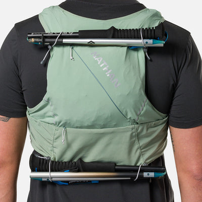color:Sage Green/Reflective Silver||seo:Nathan Pinnacle Pro 12 Liter Unisex Hydration Race Vest - Sage Green/Reflective Silver - Detail View of 4 Pole Keepers Located at Top and Bottom of Vest
