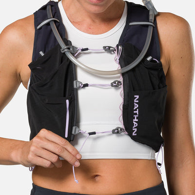 color:Black/Lilac Breeze||seo:Nathan Pinnacle Pro 12 Liter Women's Hydration Race Vest - Black/Lilac Breeze - Model Adjusting Sternum Slider Cord System