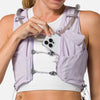 color:Lilac Breeze/Reflective Silver||seo:Nathan Pinnacle Pro 12 Liter Women's Hydration Race Vest - Lilac Breeze/Reflective Silver - Female Runner Pulling iPhone From Front Storage Pocket