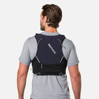 color:Black/Reflective Silver||seo:Nathan Pinnacle Pro 6 Liter Unisex Hydration Race Vest - Black/Reflective Silver - Male Runner Back View