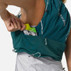 color:Deep Teal/Reflective Silver||seo:Nathan Pinnacle Pro 6 Liter Women's Hydration Race Vest - Deep Teal/Reflective Silver - Female Runner Pulling Glukos Energy Gel (Lemon Lime Flavor) From Easy-Access Kangaroo Pocket