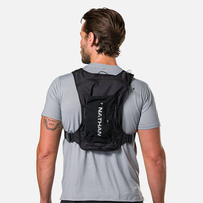 color:Black/Reflective Silver||seo:Nathan QuickStart 3.0 6 Liter Hydration Pack - Black/Reflective Silver - On Model - Back View