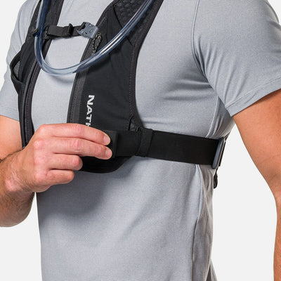 color:Black/Reflective Silver||seo:Nathan QuickStart 3.0 6 Liter Hydration Pack - Black/Reflective Silver - On Model - Model Adjusting Wide Side Straps For a Secure No Bounce Fit