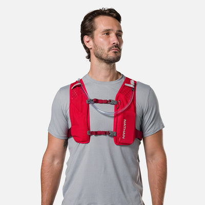 color:Ribbon Red/Reflective Silver||view:sku image back||seo:Nathan QuickStart 3.0 6 Liter Hydration Pack - Ribbon Red/Reflective Silver - On Model - Front View