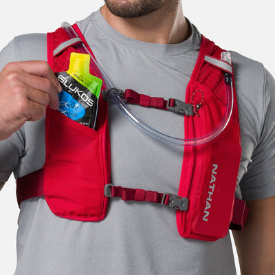 color:Ribbon Red/Reflective Silver||seo:Nathan QuickStart 3.0 6 Liter Hydration Pack - Ribbon Red/Reflective Silver - Model Pulling Glukos Liquid Energy Liquid Gel (Lemon Lime Flavor ) from Pouch