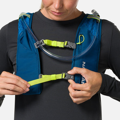 color:Sailor Blue/Reflective Silver||seo:Nathan QuickStart 3.0 6 Liter Hydration Pack - Sailor Blue/Reflective Silver - On Model - Model Tightening Sternum Straps For Better Fit