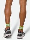 Nathan Hypernight Reflective Straps – Safety Yellow – On Model – Back Ankle View