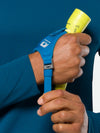 Nathan Polaris 200R Runner’s Hand Torch – Safety Yellow/Blue – On Model – Model Tightening Strap For Better Fit