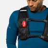 color:Ribbon Red||seo:Nathan StrobeLight 2.0 Safety LED Light Clip - Ribbon Red - On Model - Detail View of StrobeLight Attached to Vest