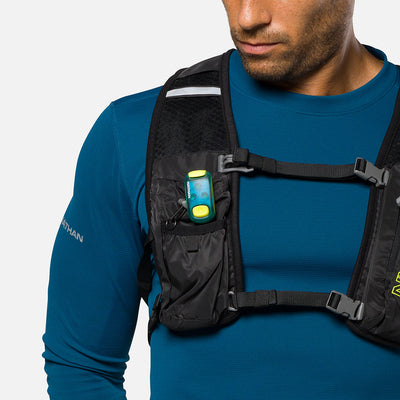 color:Deep Blue||seo:Nathan StrobeLight 2.0 Safety LED Light Clip - Deep Blue - On Model - Detail View of Strobelight Attached to Vest