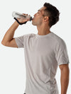 Nathan ExoShot Lite 14oz Hydration Handheld - Runner Sipping Water