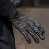 Closeup Shot of Runner Sliding On NATHAN Men's Black Reflective Gloves with Topography Design