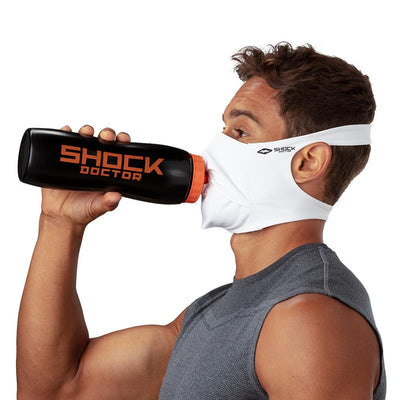 White Play Safe Face Mask – Male Model Wearing Protective Safety Face Mask while Drinking a Hydration Water Bottle - Left Angle