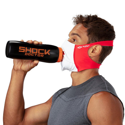 Canada Flag Play Safe Face Mask –Male Model Wearing Protective Safety Face Mask while Drinking a Hydration Water Bottle - Left Angle
